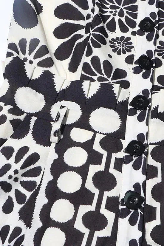 Vintage Floral Polka Dot Romper with Smocked Back, Square Neckline, and Slanted Pockets in Black and White